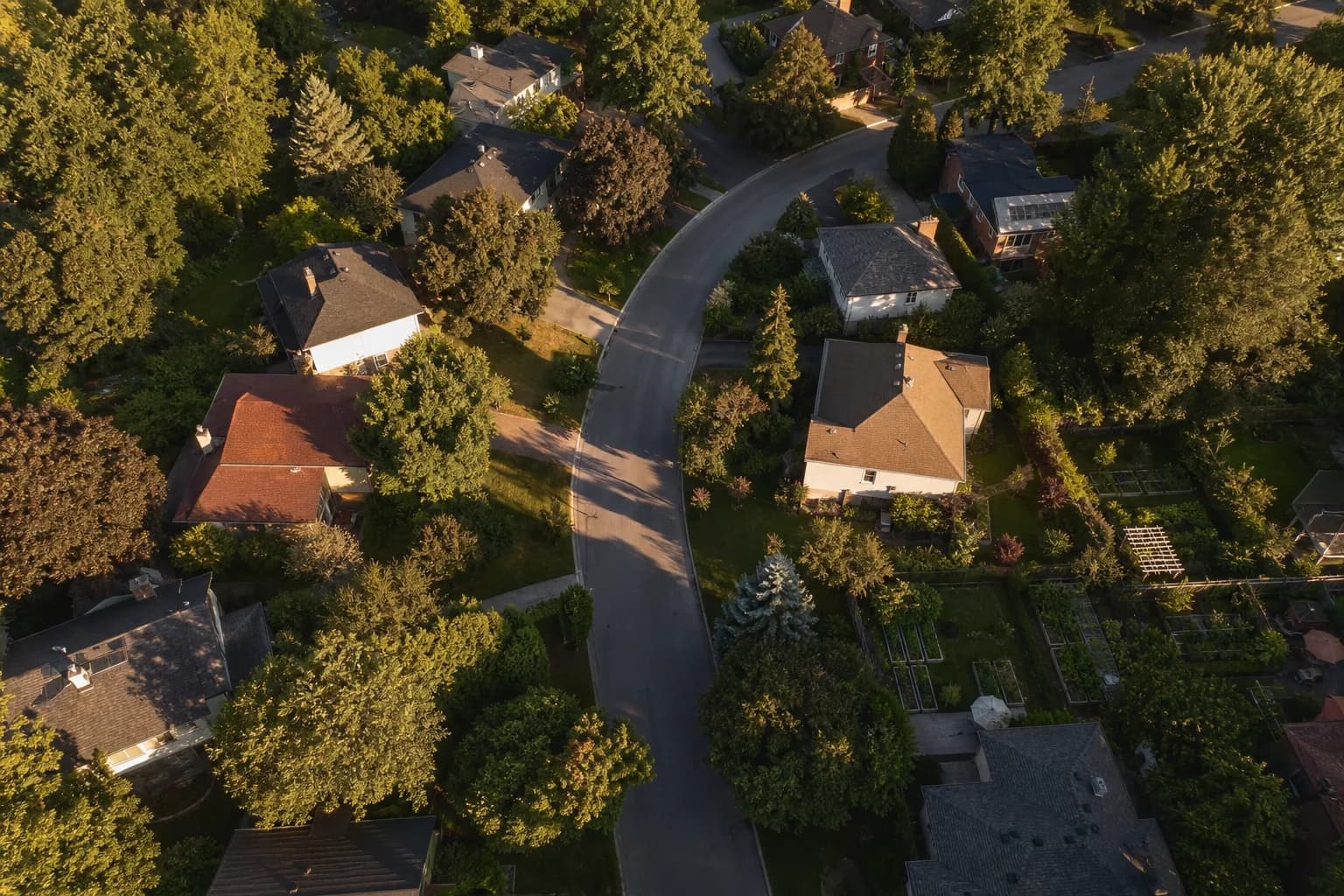 Aerial view of an established Canadian neighborhood at golden hour