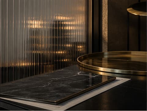 Editorial still life of investment planning documents and brass details.