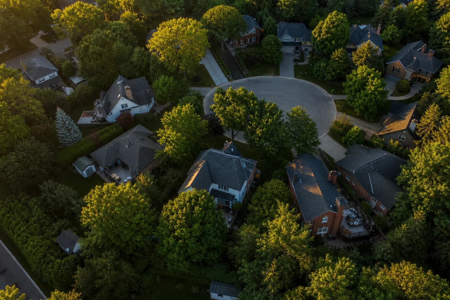 Aerial view of a quiet Canadian cul-de-sac at golden hour