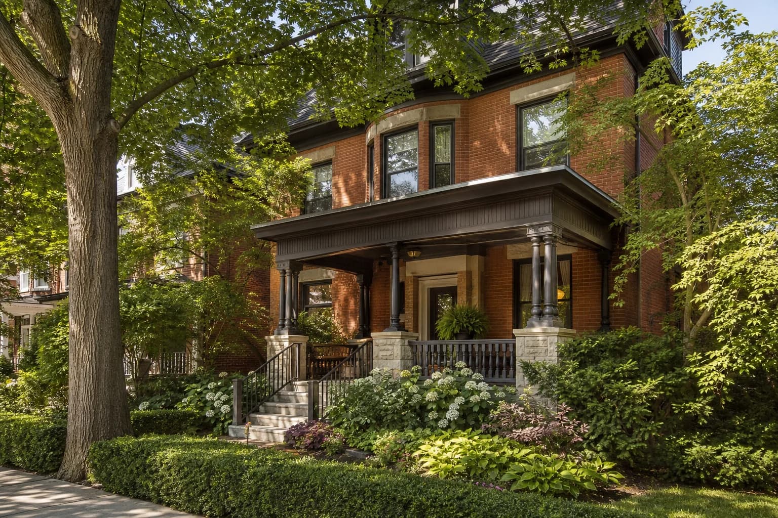 Edwardian brick home in Toronto with dappled maple shade