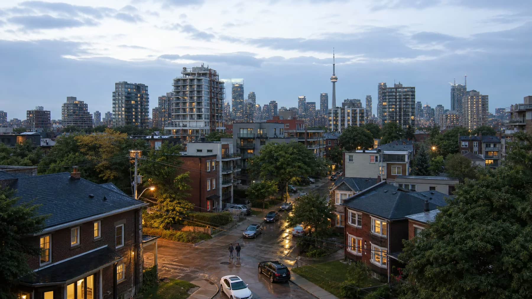 A real Toronto residential neighbourhood after summer rain at blue hour, illustrating Canada's housing economy